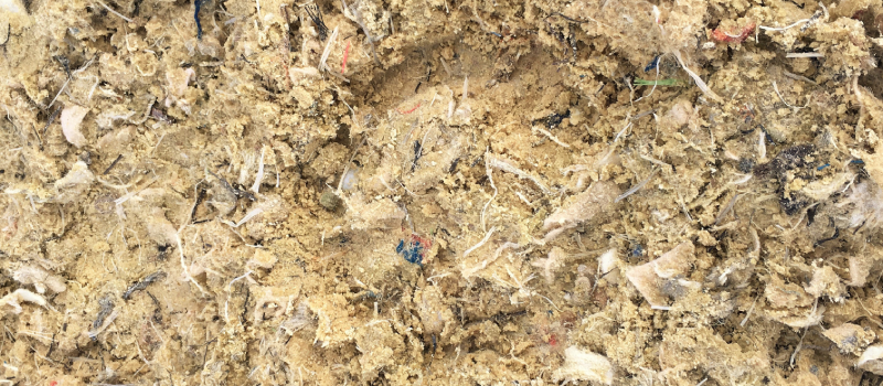 fibremixv2 A horse hoof print in a sample of Equivia fibremix equestrian surface